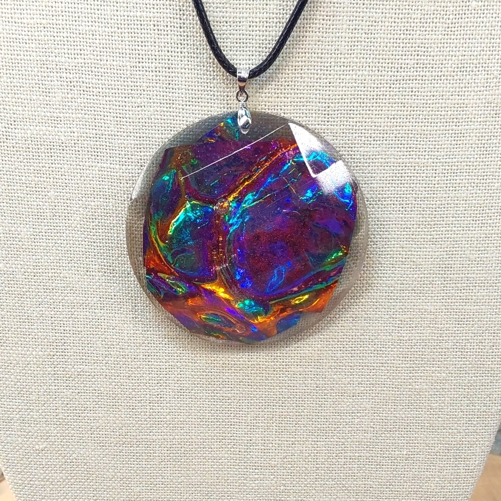 Pendent with chain 2 and a 1/2 inches.Wide